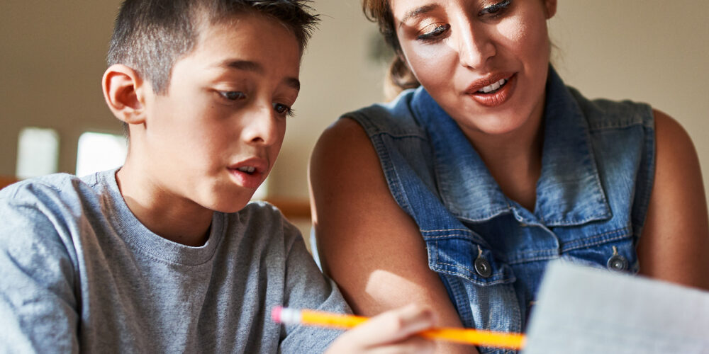 mother helping son with homework