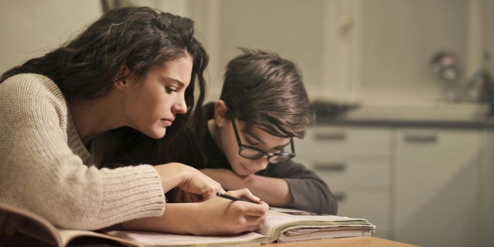 A mother checking her son's homework
